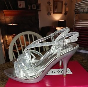 Silver Slipper NWT  Silver HeelsSize 8M New in box.